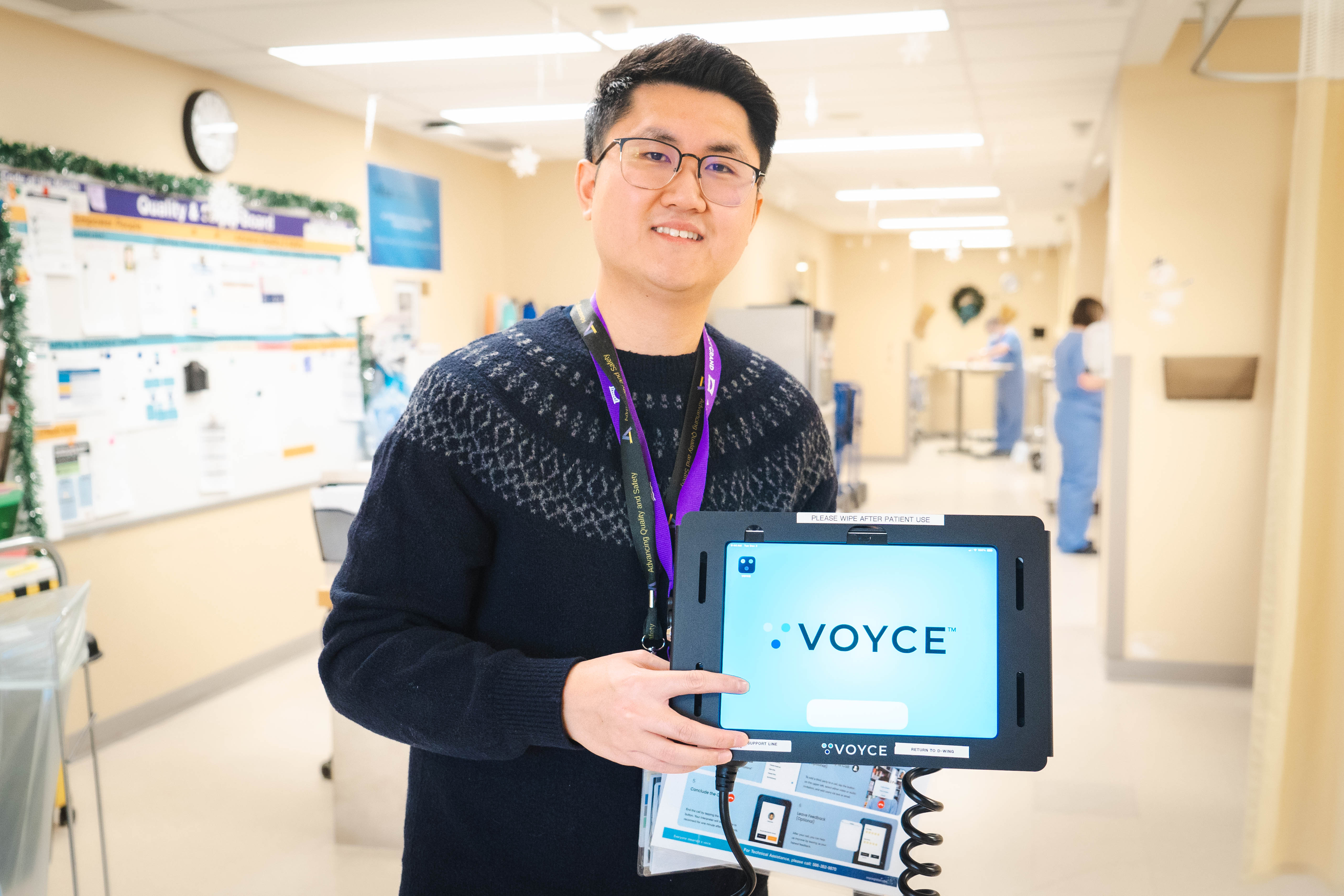 Alden Leung, BCHS Quality and Risk consultant, stands with a Voyce device at Brantford General Hospital