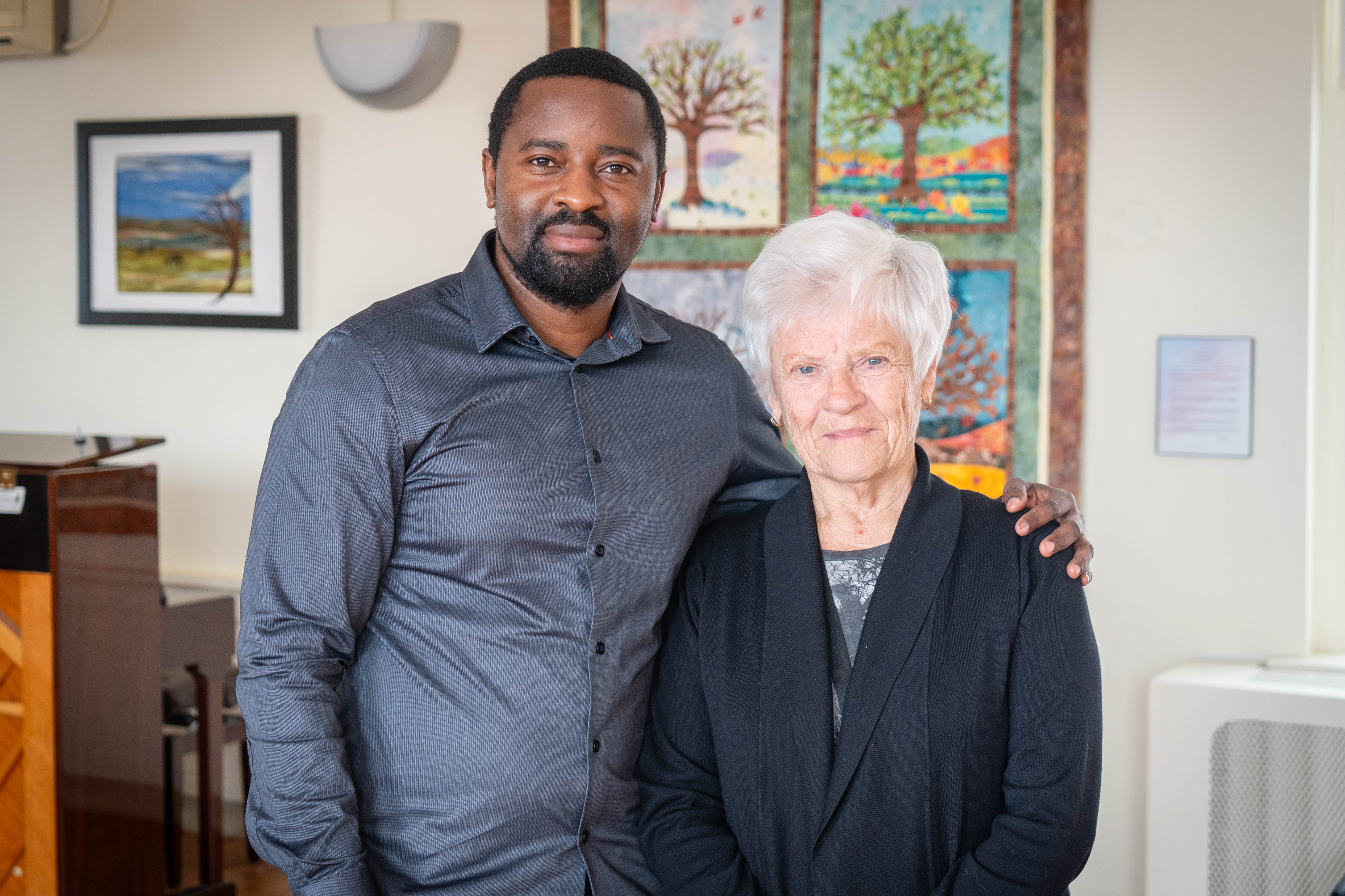 Matthew Mutamiri, clinical manager of inpatient mental health and addictions and spiritual care, stands with Carol Caswell, spiritual care practitioner, in the multifaith centre at Brantford General Hospital.